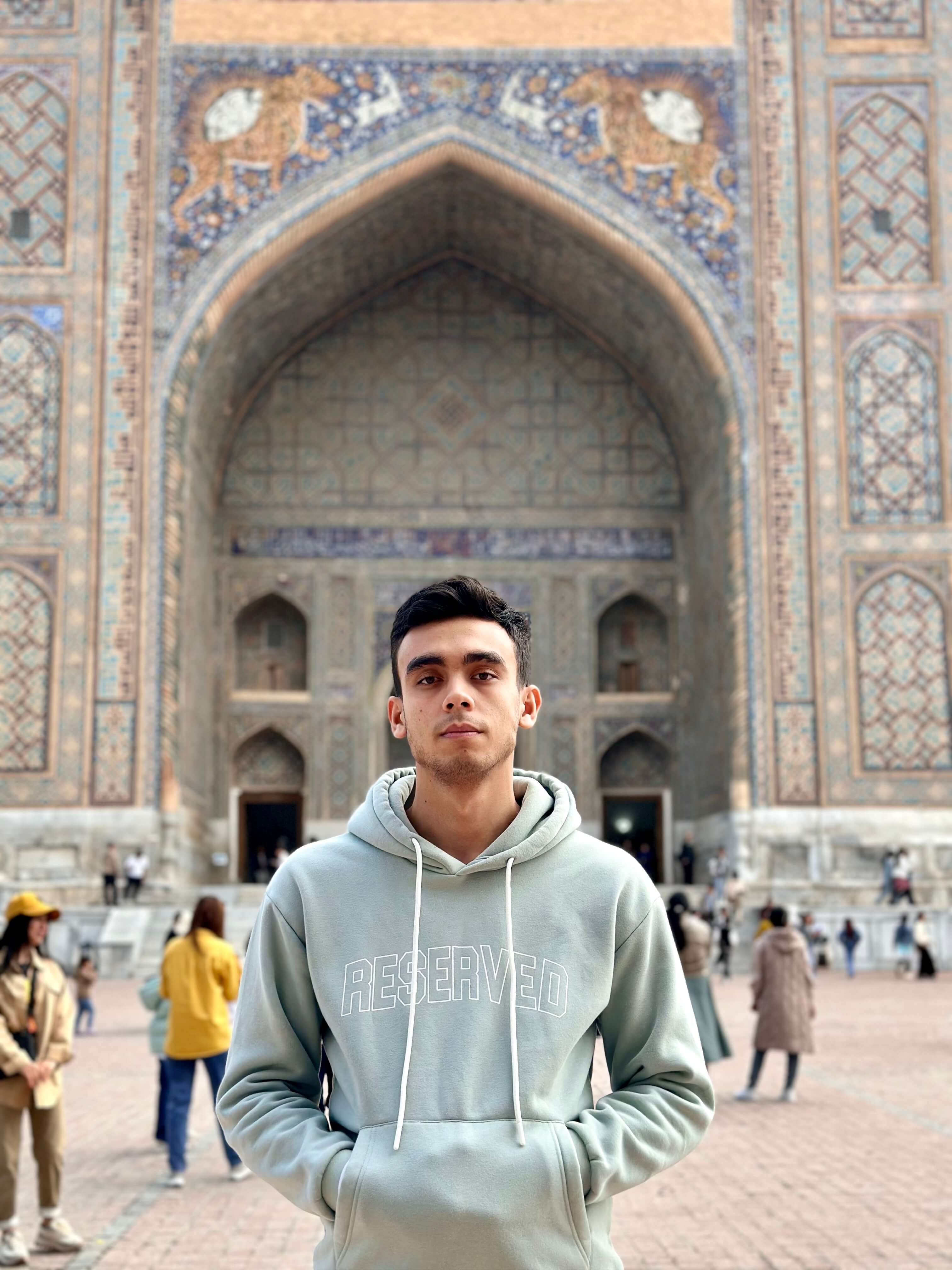 Aslbek Kucharov's photo against the background of Registan Square